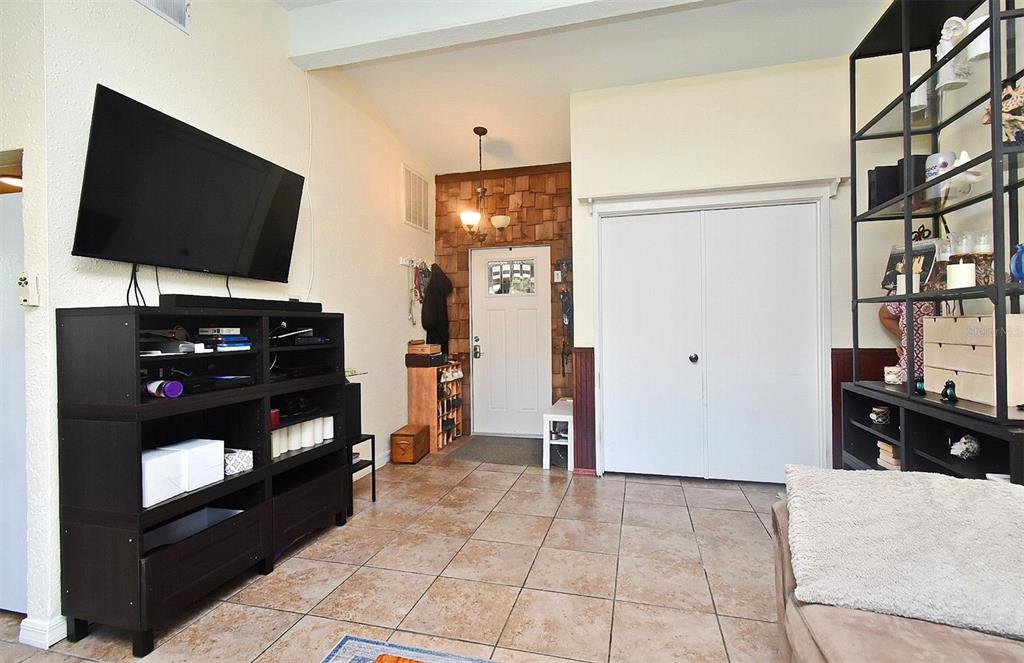 31 Chip Court Kissimmee, FL 34759 - Photo 34 of 37 a living room with television and a flat screen tv
