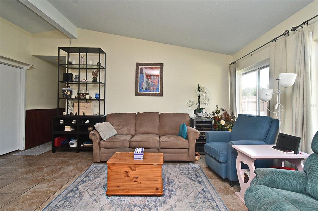 31 Chip Court Kissimmee, FL 34759 - Photo 35 of 37 a living room with furniture and a large window