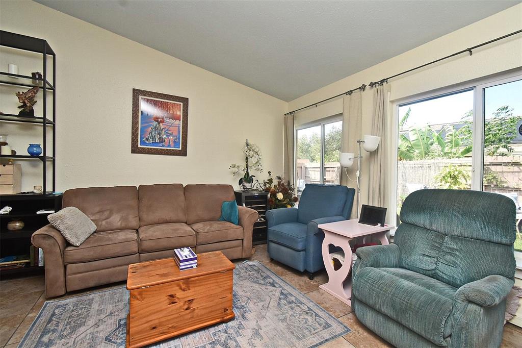 31 Chip Court Kissimmee, FL 34759 - Photo 36 of 37 a living room with furniture and a large window