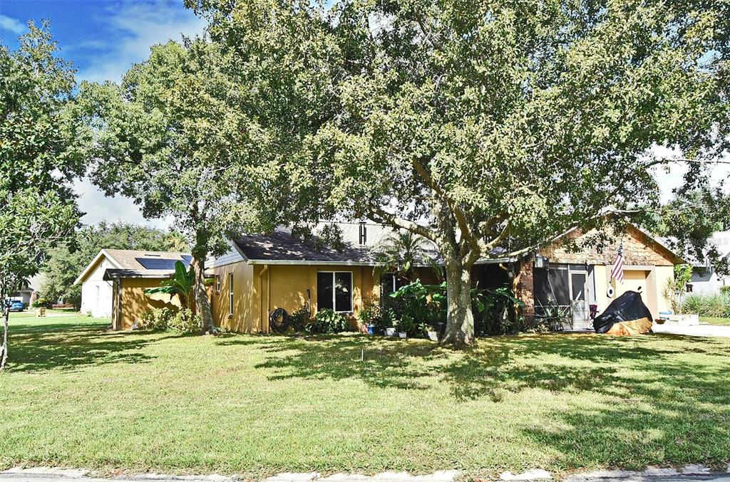 31 Chip Court Kissimmee, FL 34759 - Photo 4 of 37 a view of a house with a yard