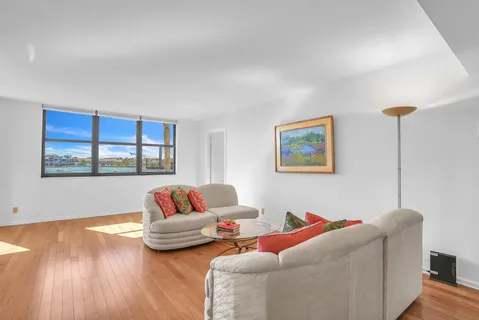 a living room with a couch and a window