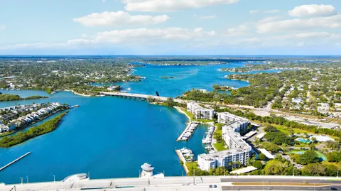 an aerial view of a house with a swimming pool yard and mountain view in back