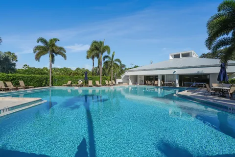 a front view of house with yard and outdoor seating