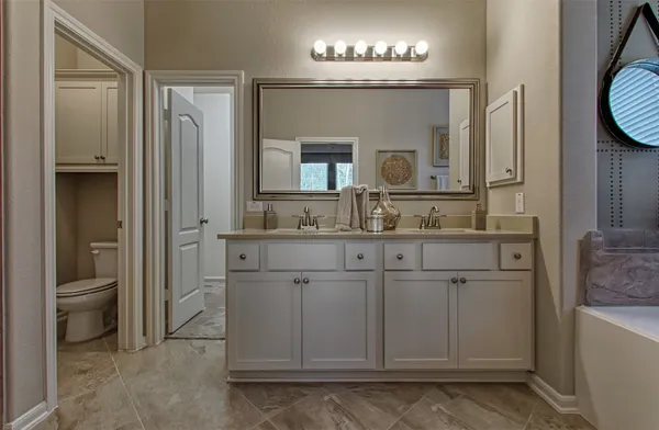 a bath room with a sink and a bath tub