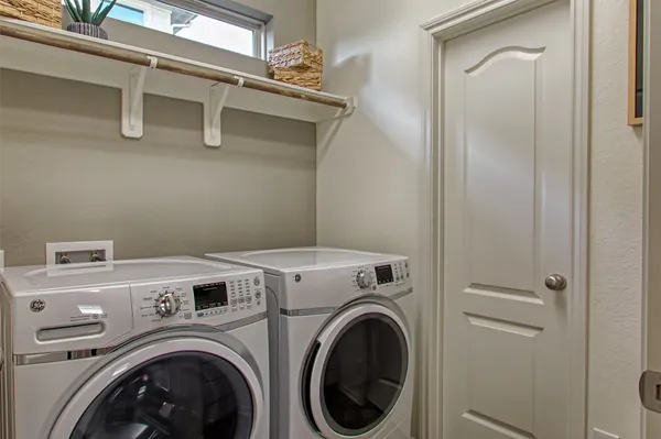 a bedroom with furniture and a mirror