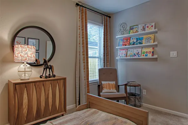 a bed room with a bed and a desk