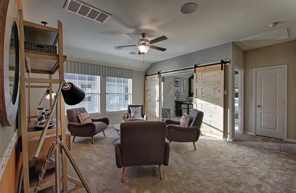 a view of a livingroom with furniture and window