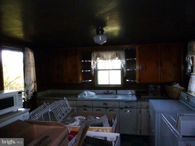 271 Fairview Road Gore, VA 22637 - Photo 11 of 29 a kitchen with furniture a sink and a window