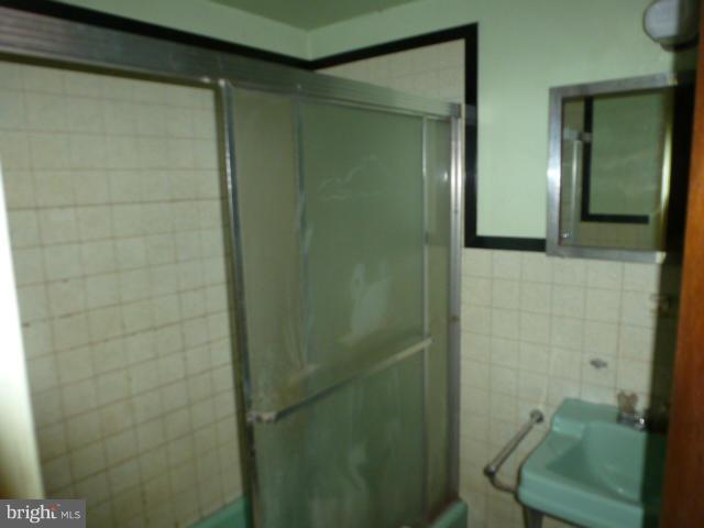 271 Fairview Road Gore, VA 22637 - Photo 17 of 29 a bathroom with a shower and a sink