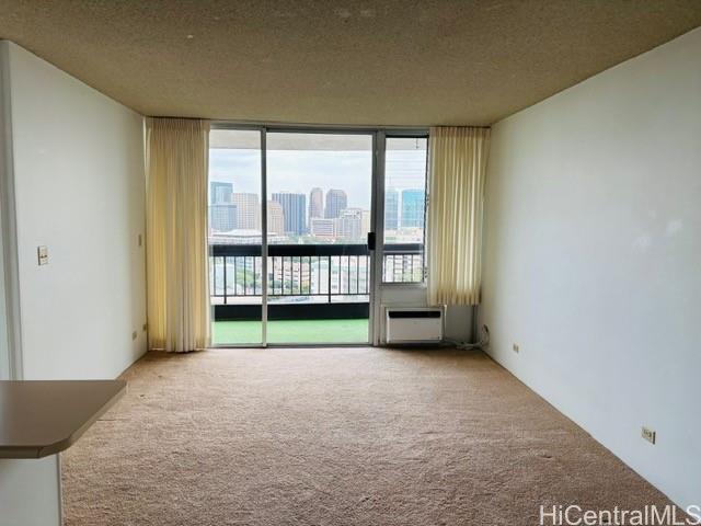 775 Kinalau Place, Unit 2008 Honolulu, HI 96813 - Photo 4 of 14 an empty room with sliding door