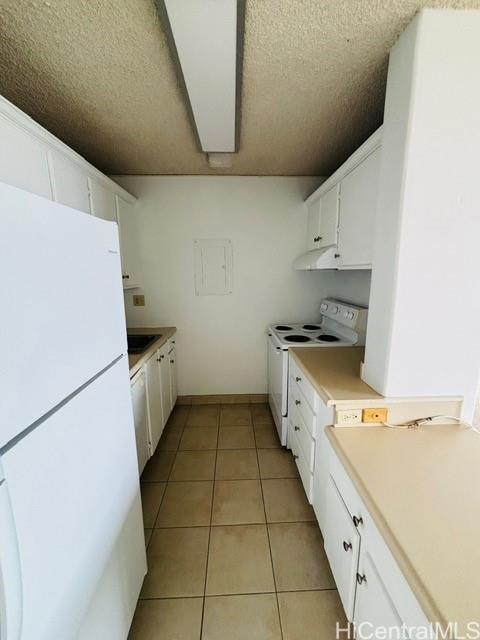775 Kinalau Place, Unit 2008 Honolulu, HI 96813 - Photo 6 of 14 a kitchen with a sink a stove and a refrigerator