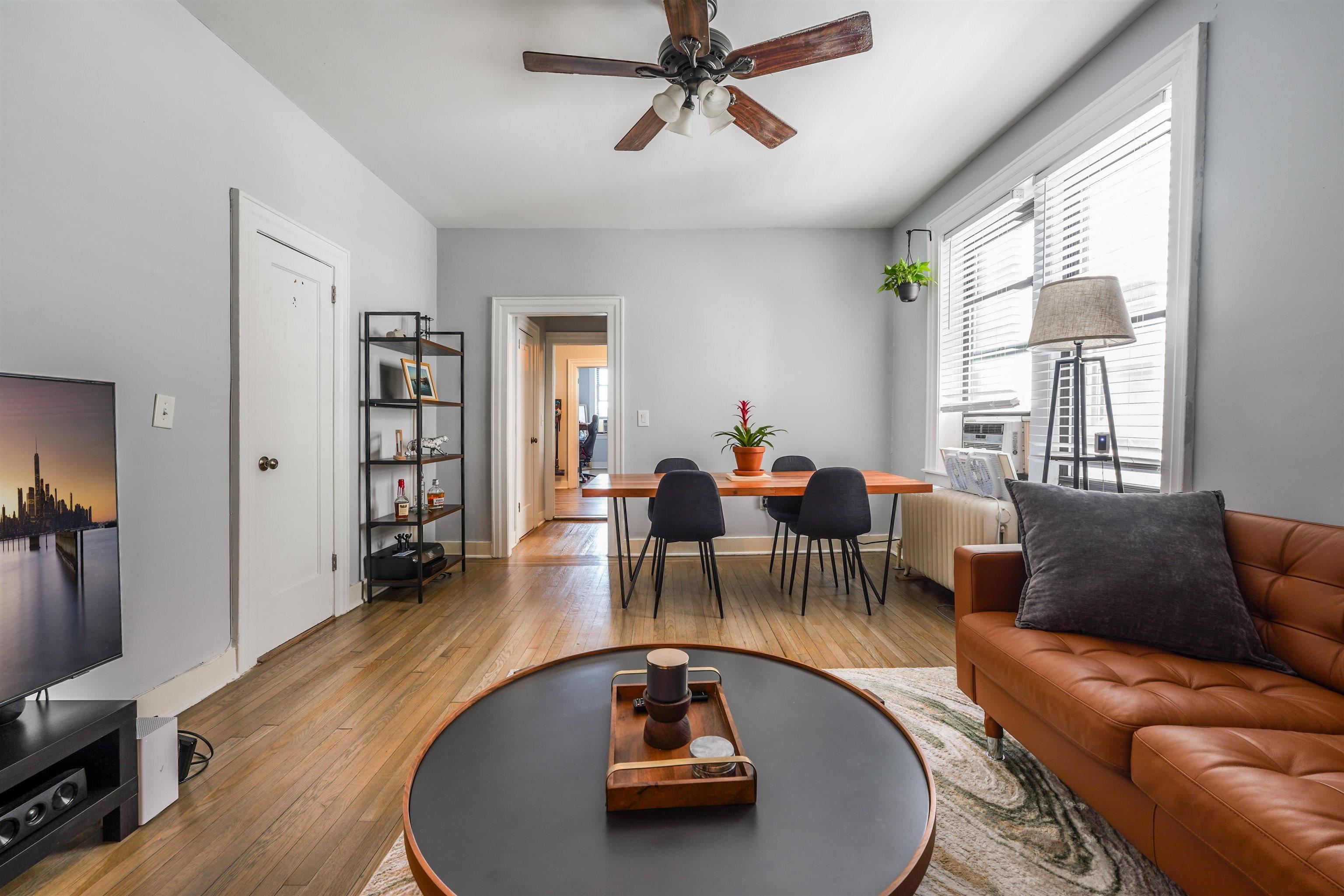 331 79th Street, Unit 53 North Bergen, NJ 07047 - Photo 1 of 14 a living room with furniture and a wooden floor