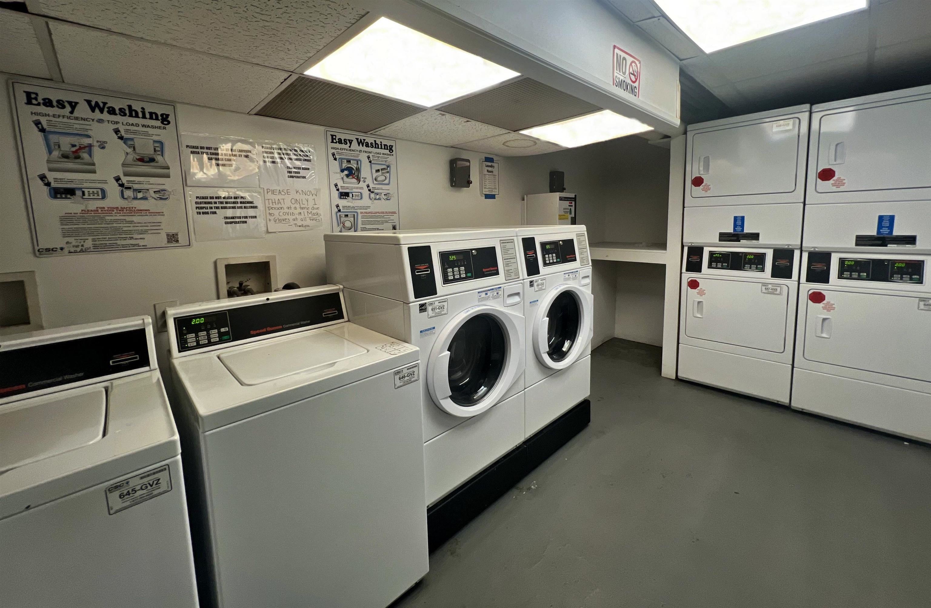 331 79th Street, Unit 53 North Bergen, NJ 07047 - Photo 11 of 14 a utility room with dryer and washer