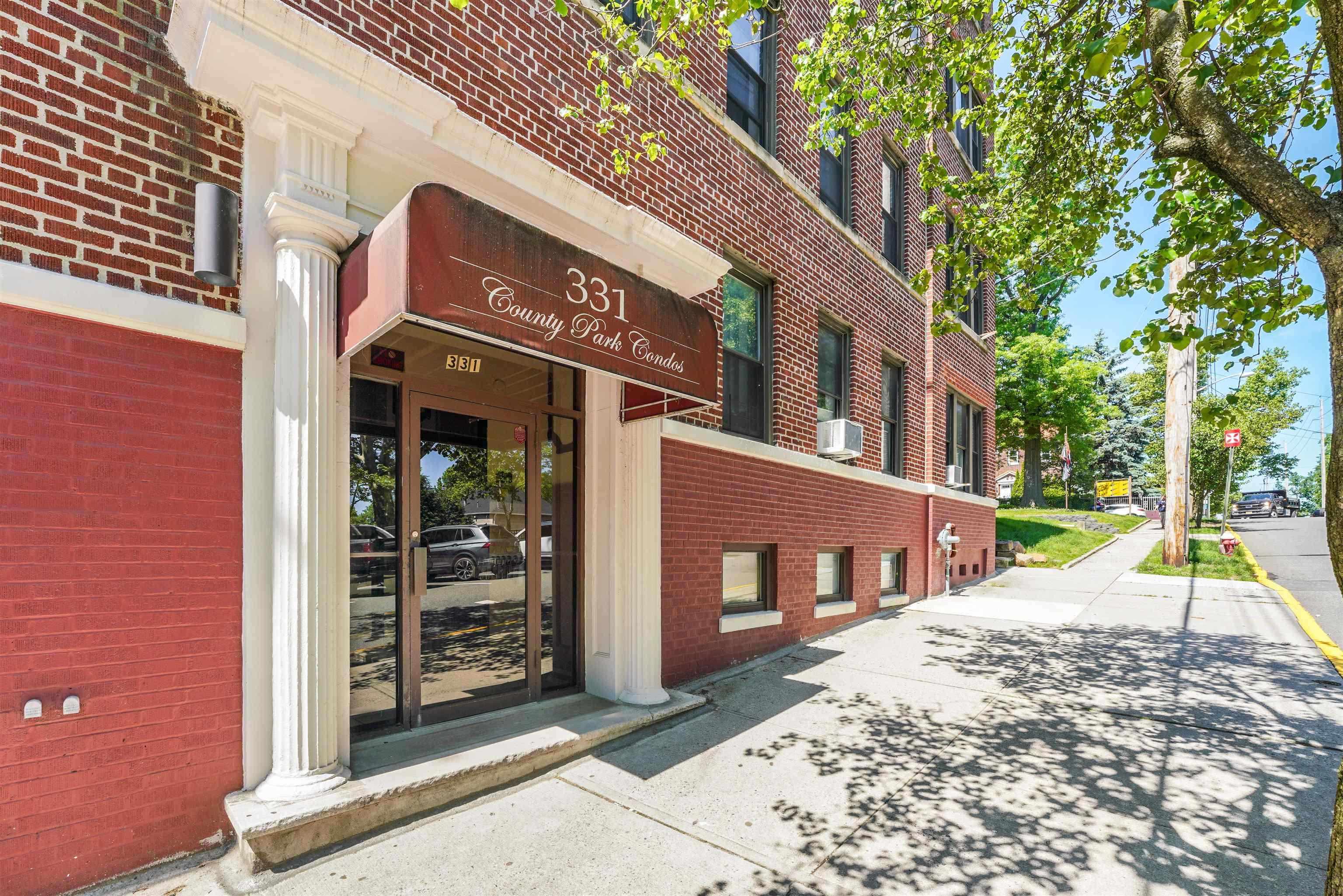 331 79th Street, Unit 53 North Bergen, NJ 07047 - Photo 14 of 14 a view of a building with a street