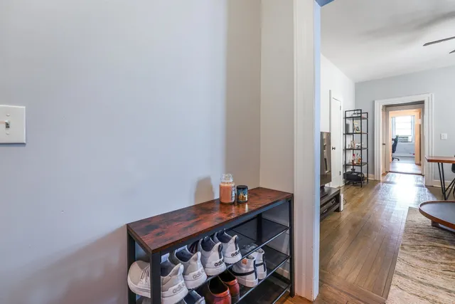 a room with wooden floor and furniture