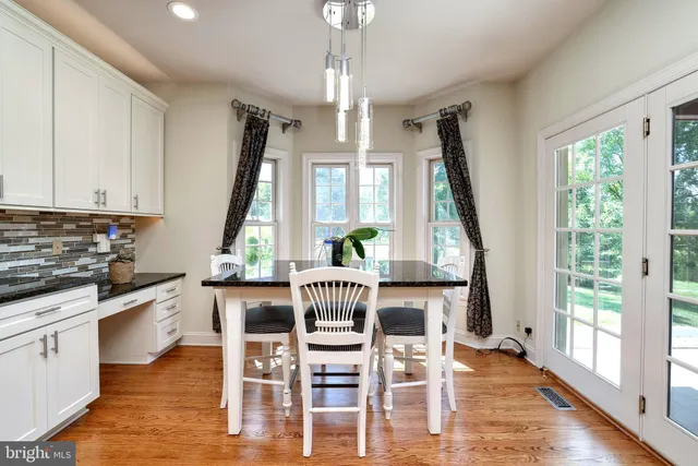 a bathroom with a toilet a sink and a mirror