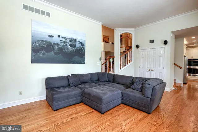 a living room with furniture a fireplace and a large window