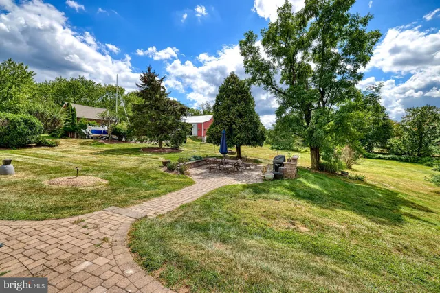 a view of a house with a yard and garage