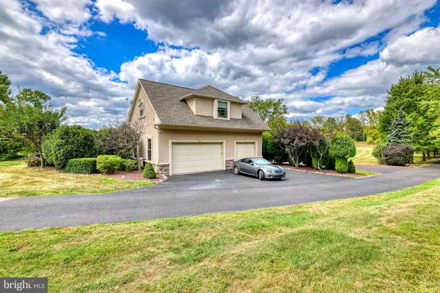 a view of a house with backyard porch and sitting area