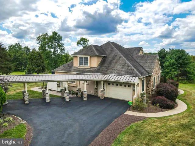 an aerial view of a house with outdoor space