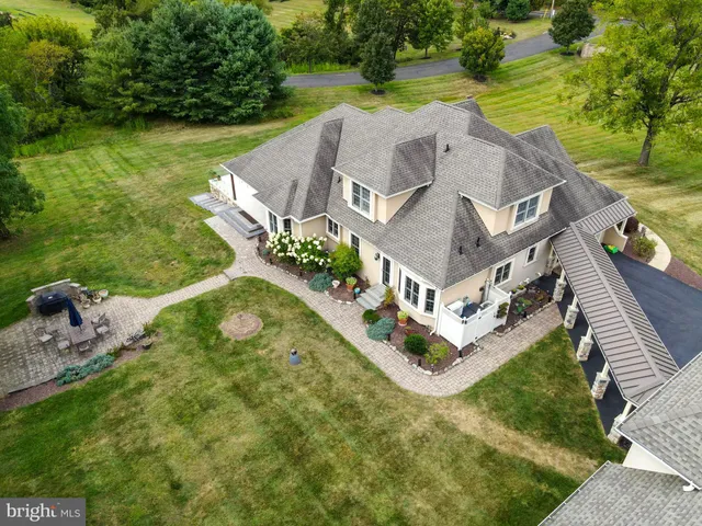 swimming pool view with a garden view