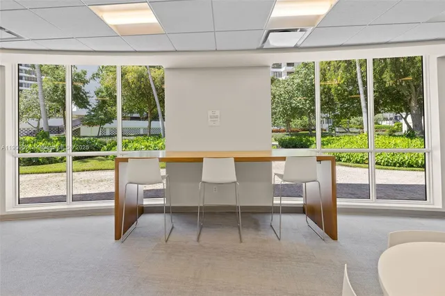 a view of an empty room with a large window