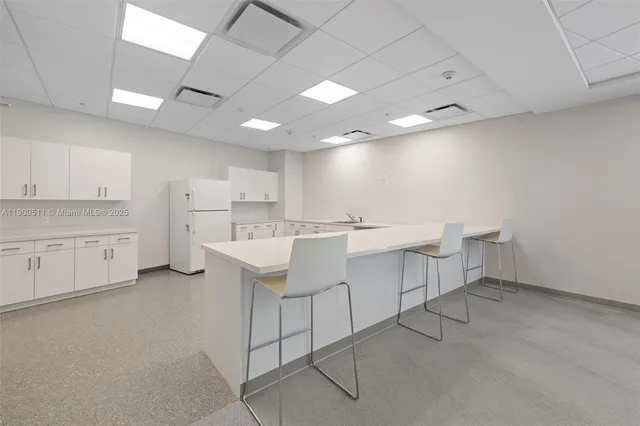 a view of a livingroom with furniture and window