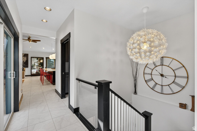 145 Carnesecca Court Mapleton, UT 84664 - Photo 22 of 109 Hallway with an upstairs landing and hanging lights