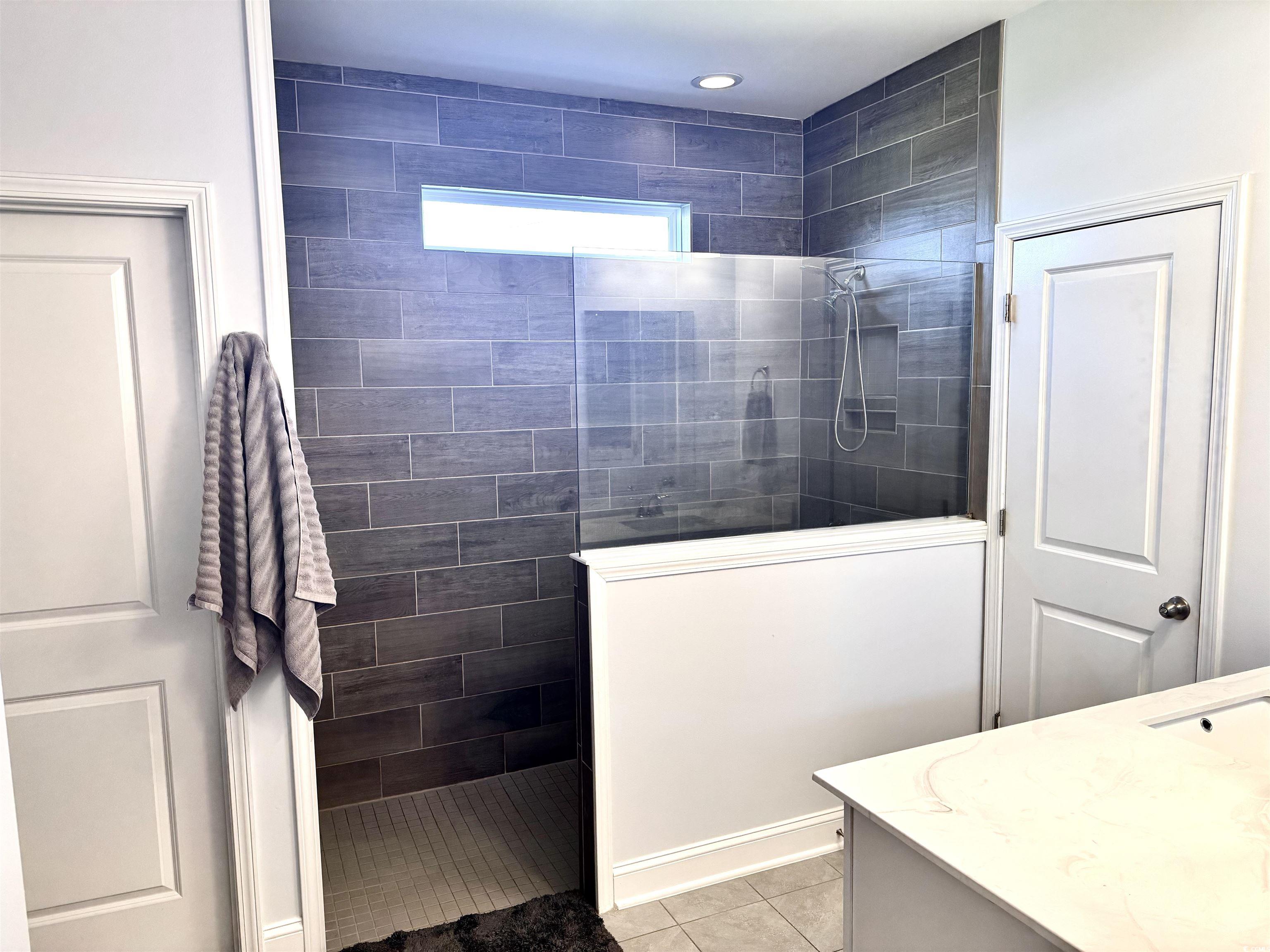 405 Spring View Little River, SC 29566 - Photo 15 of 40 Full bathroom featuring walk in shower, vanity, and tile patterned floors