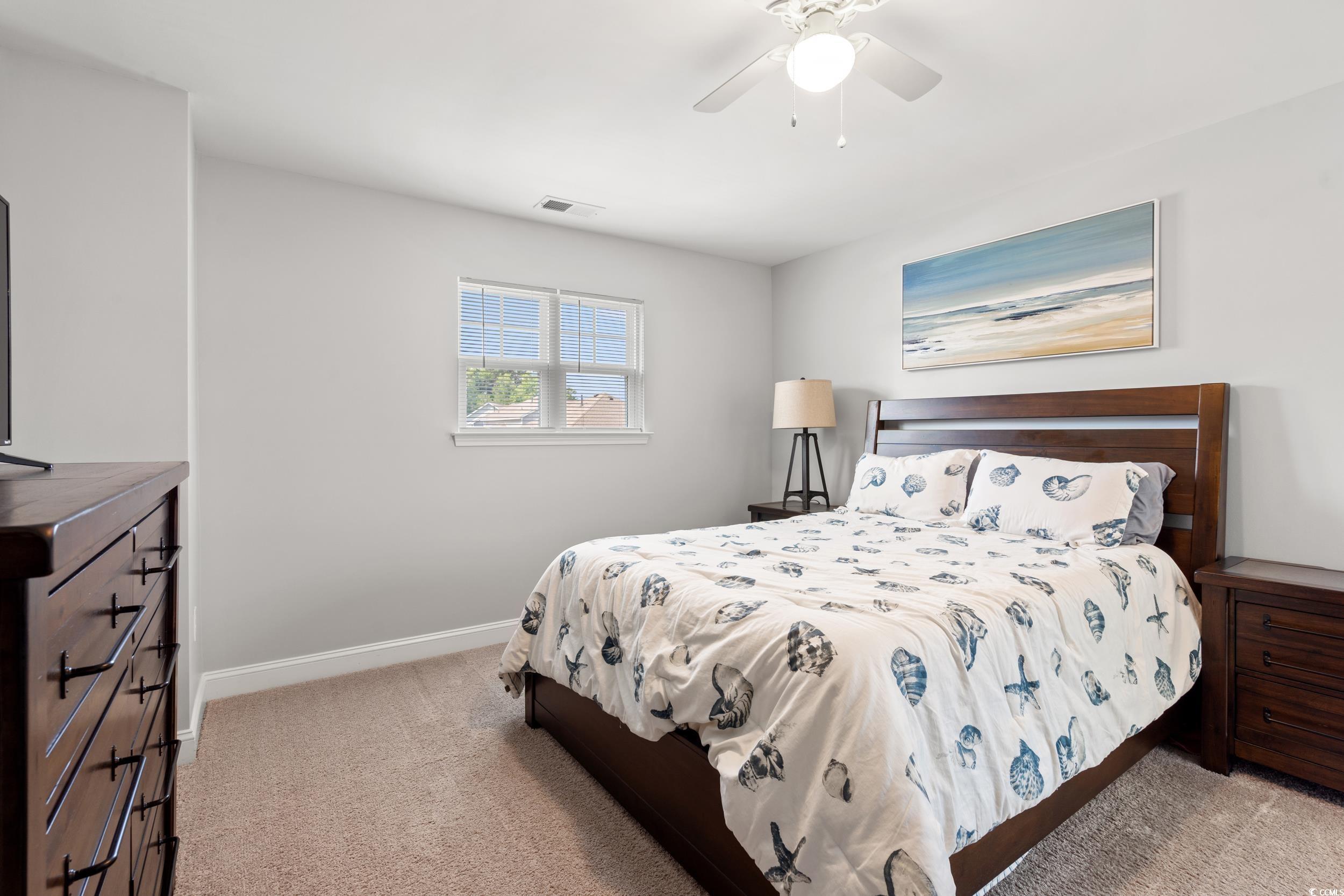 405 Spring View Little River, SC 29566 - Photo 23 of 40 Bedroom with carpet floors and a ceiling fan