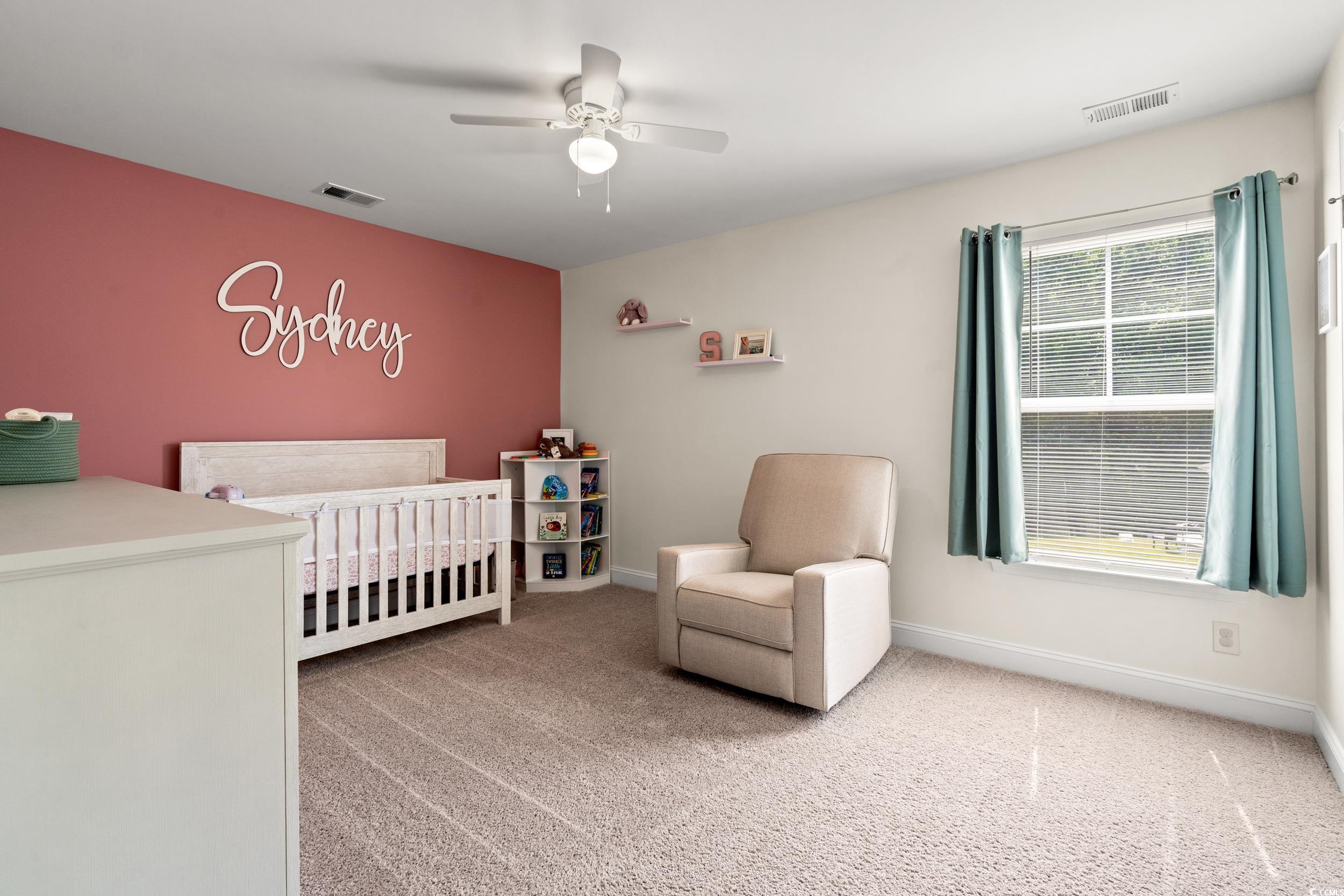 405 Spring View Little River, SC 29566 - Photo 29 of 40 Bedroom with a crib, carpet, and a ceiling fan