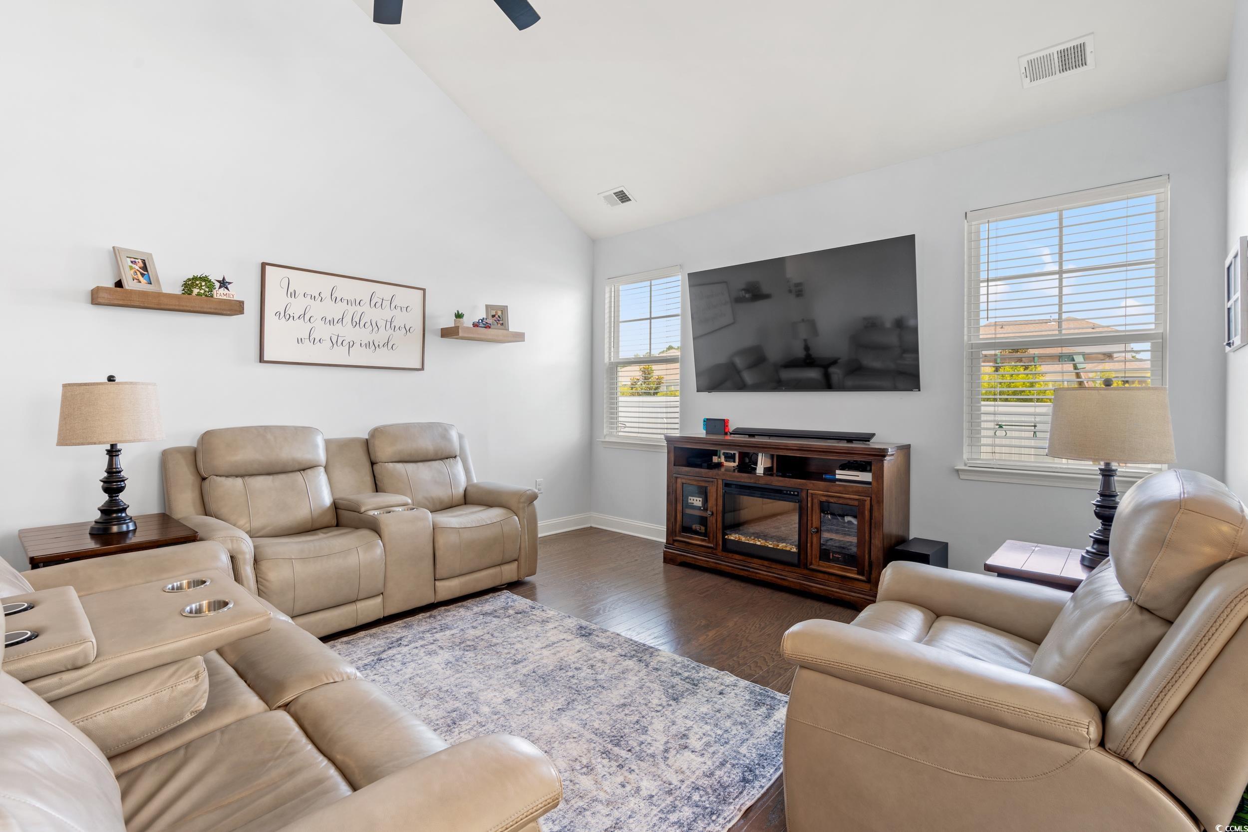 405 Spring View Little River, SC 29566 - Photo 6 of 40 Living area with dark wood-type flooring, ceiling fan, and vaulted ceiling