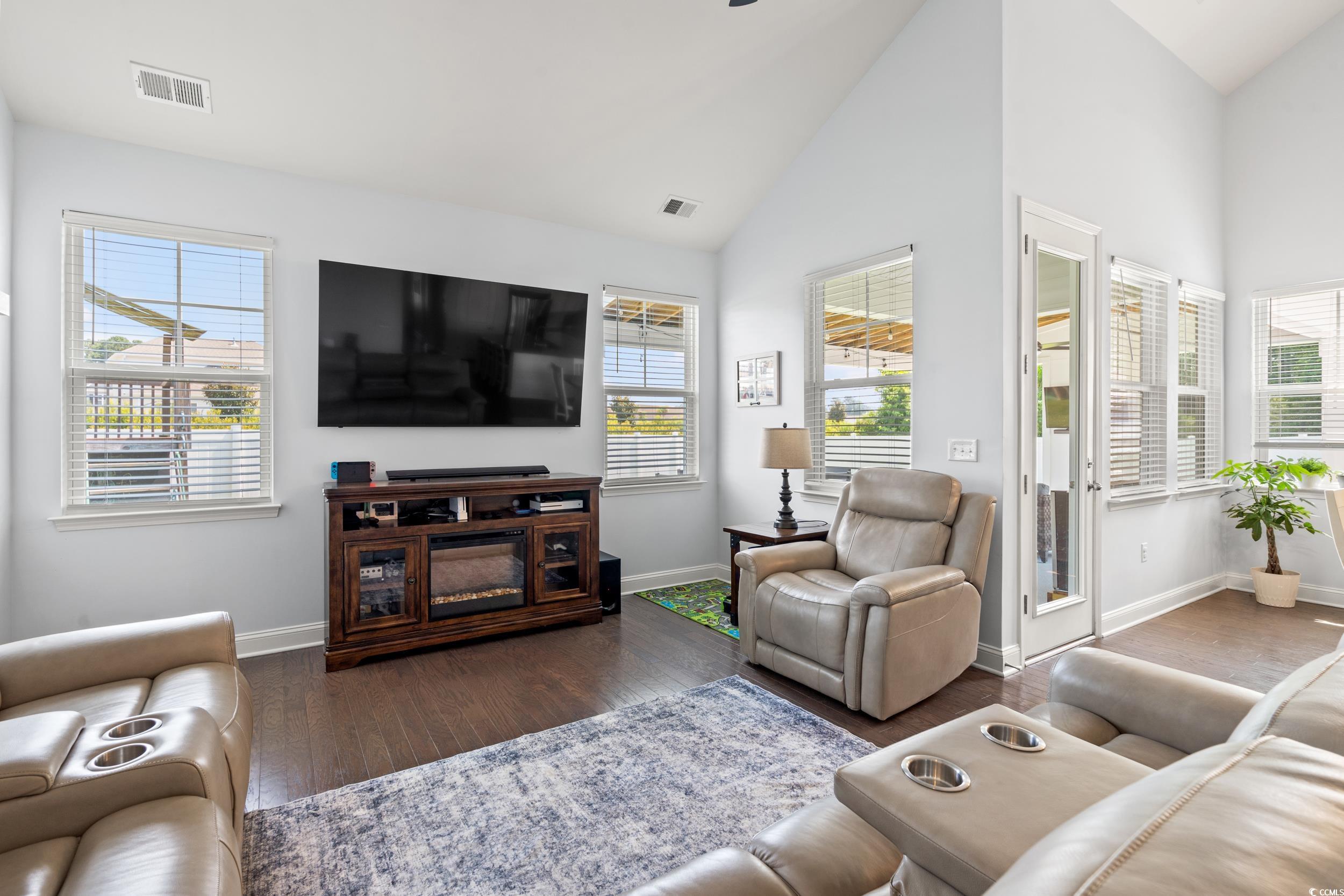 405 Spring View Little River, SC 29566 - Photo 7 of 40 Living room featuring wood finished floors and high vaulted ceiling