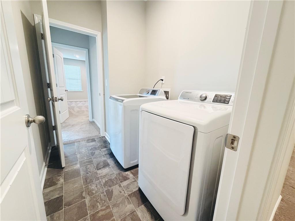 607 Michigan Circle Hoschton, GA 30548 - Photo 15 of 27 a utility room with dryer and washer