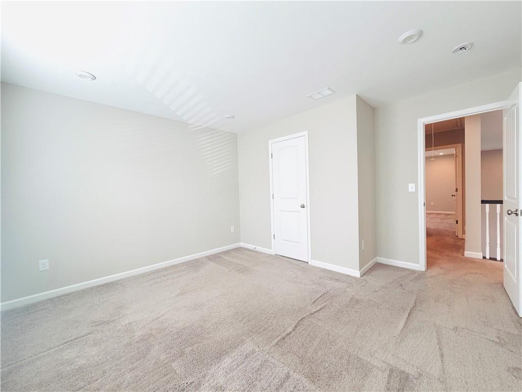 607 Michigan Circle Hoschton, GA 30548 - Photo 18 of 27 an empty room with closet area