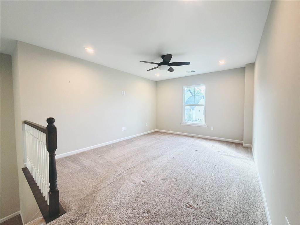 607 Michigan Circle Hoschton, GA 30548 - Photo 19 of 27 a view of an empty room with a window