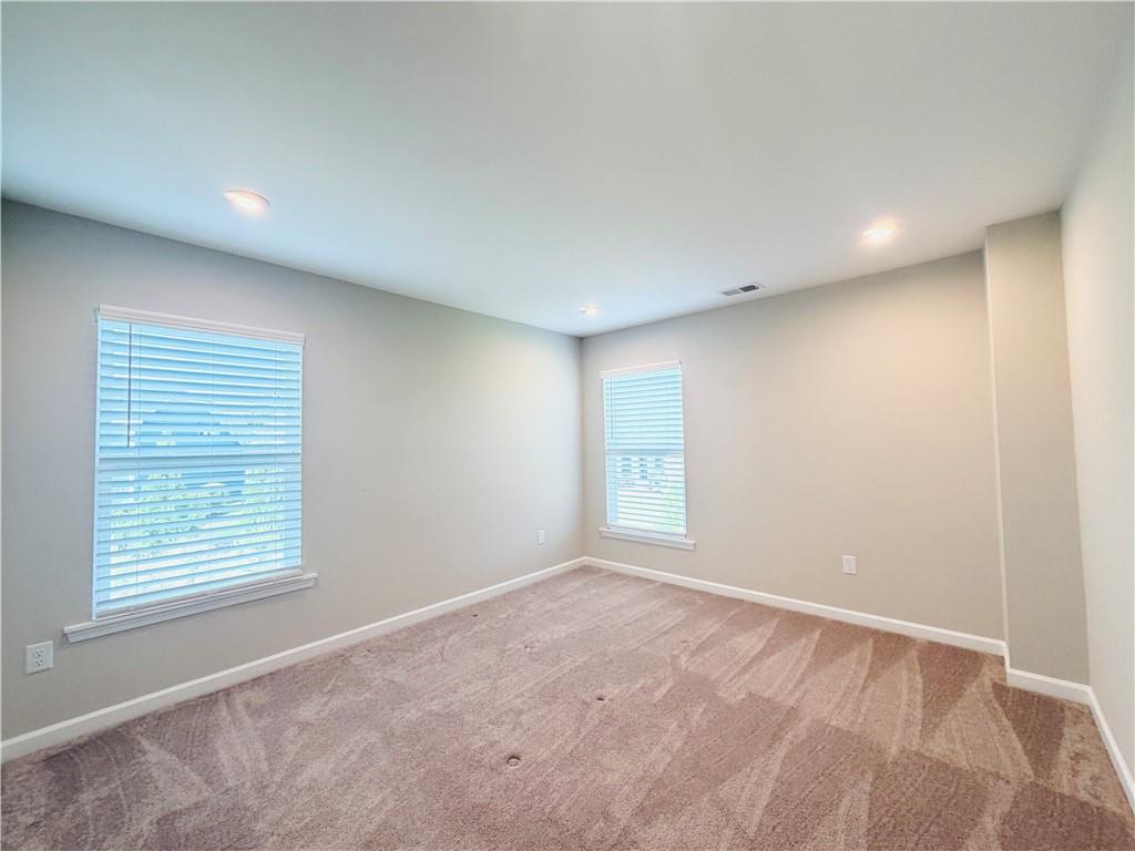 607 Michigan Circle Hoschton, GA 30548 - Photo 22 of 27 a view of an empty room with a window