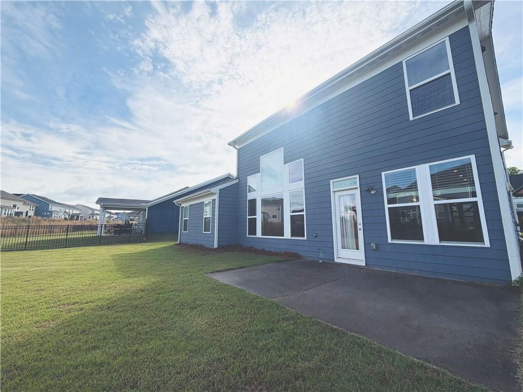 607 Michigan Circle Hoschton, GA 30548 - Photo 25 of 27 a view of a building with a yard