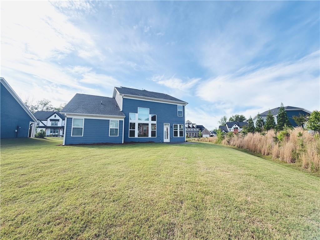 607 Michigan Circle Hoschton, GA 30548 - Photo 26 of 27 a front view of a house with a yard