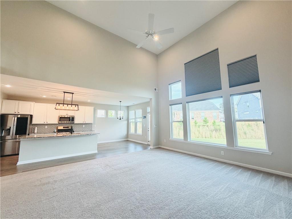 607 Michigan Circle Hoschton, GA 30548 - Photo 8 of 27 a view of an empty room with a window