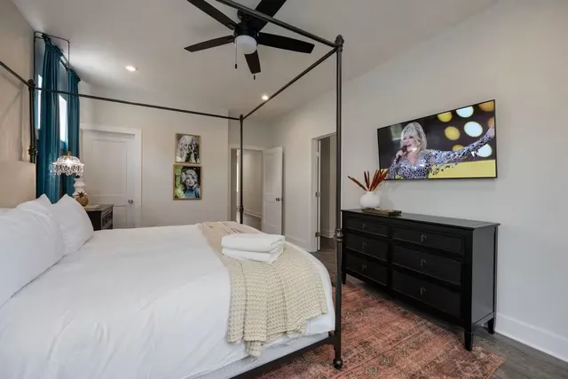 a bedroom with a bed and a dresser