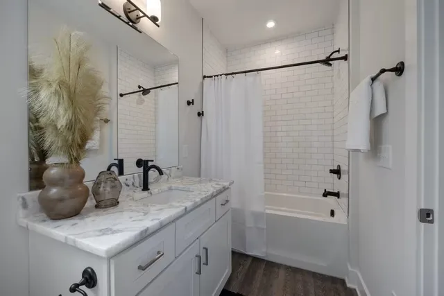 a bedroom with a bed lamps and window