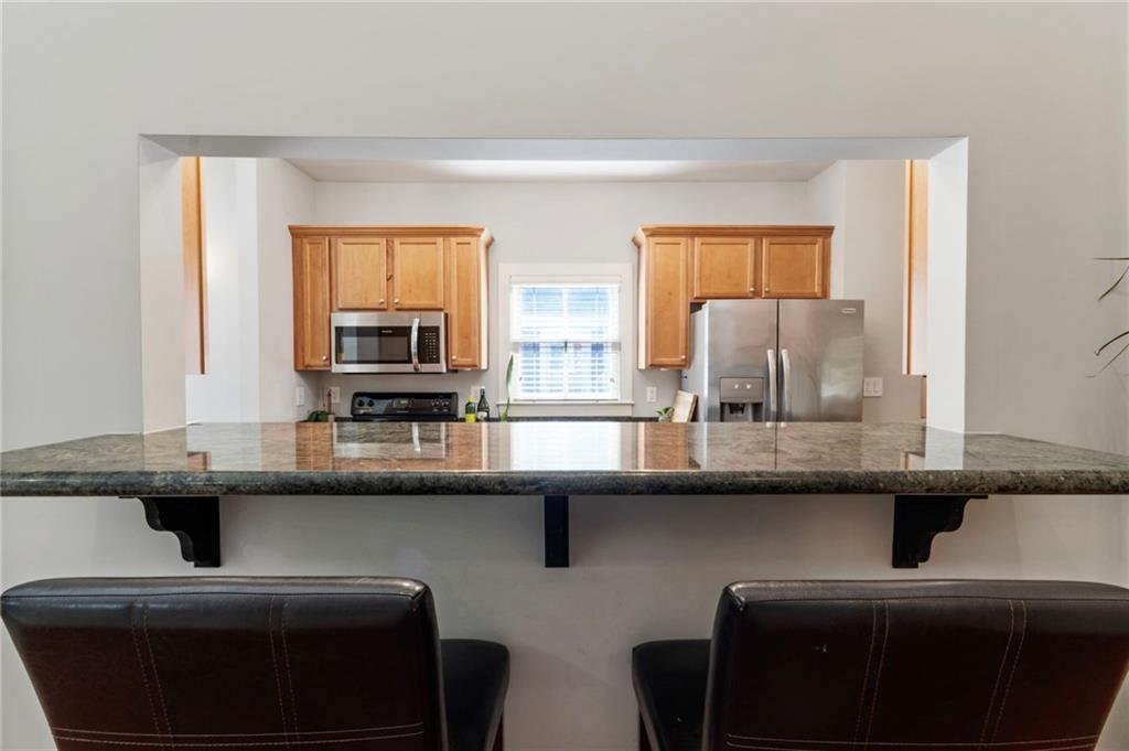 173 Berean Avenue Southeast Atlanta, GA 30316 - Photo 19 of 61 a kitchen with a sink and a refrigerator