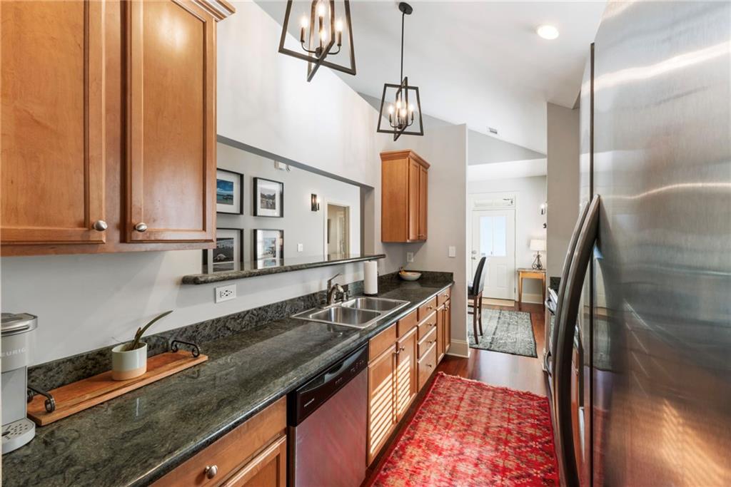 173 Berean Avenue Southeast Atlanta, GA 30316 - Photo 20 of 61 a kitchen with stainless steel appliances granite countertop a sink a stove and a refrigerator