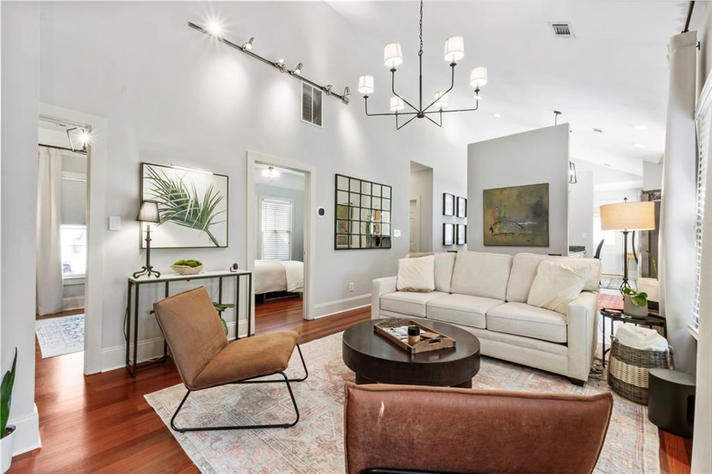 173 Berean Avenue Southeast Atlanta, GA 30316 - Photo 29 of 61 a living room with furniture kitchen view and a chandelier
