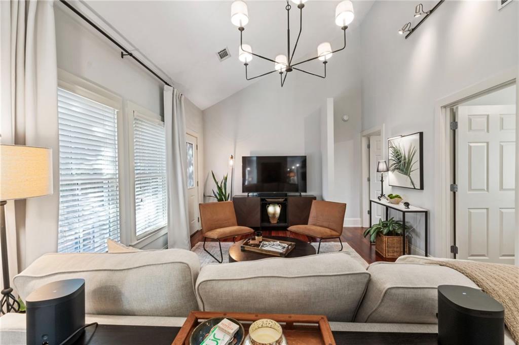 173 Berean Avenue Southeast Atlanta, GA 30316 - Photo 31 of 61 a living room with furniture a flat screen tv and a large window