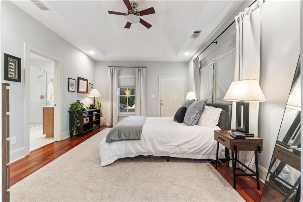 173 Berean Avenue Southeast Atlanta, GA 30316 - Photo 34 of 61 a bedroom with a bed lamps and a large mirror on the dresser