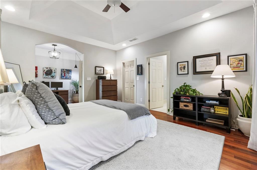 173 Berean Avenue Southeast Atlanta, GA 30316 - Photo 36 of 61 a bedroom with a bed and a chandelier