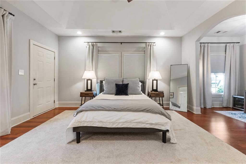 173 Berean Avenue Southeast Atlanta, GA 30316 - Photo 38 of 61 a spacious bedroom with a bed and wooden floor