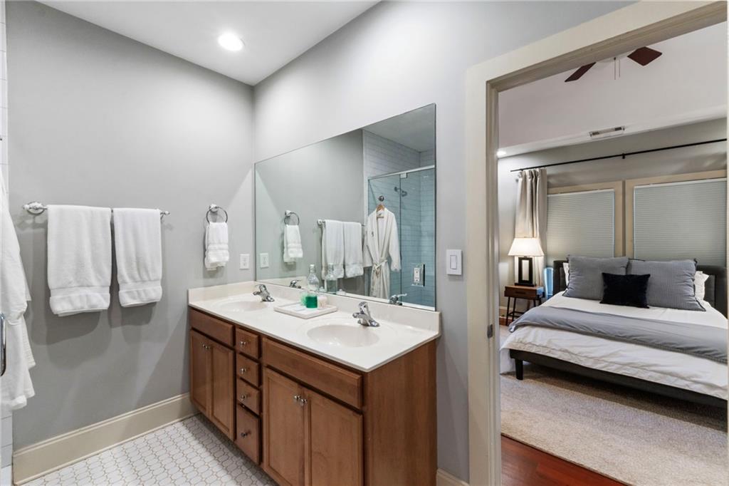 173 Berean Avenue Southeast Atlanta, GA 30316 - Photo 41 of 61 a en suite bathroom with a double vanity sink and a mirror